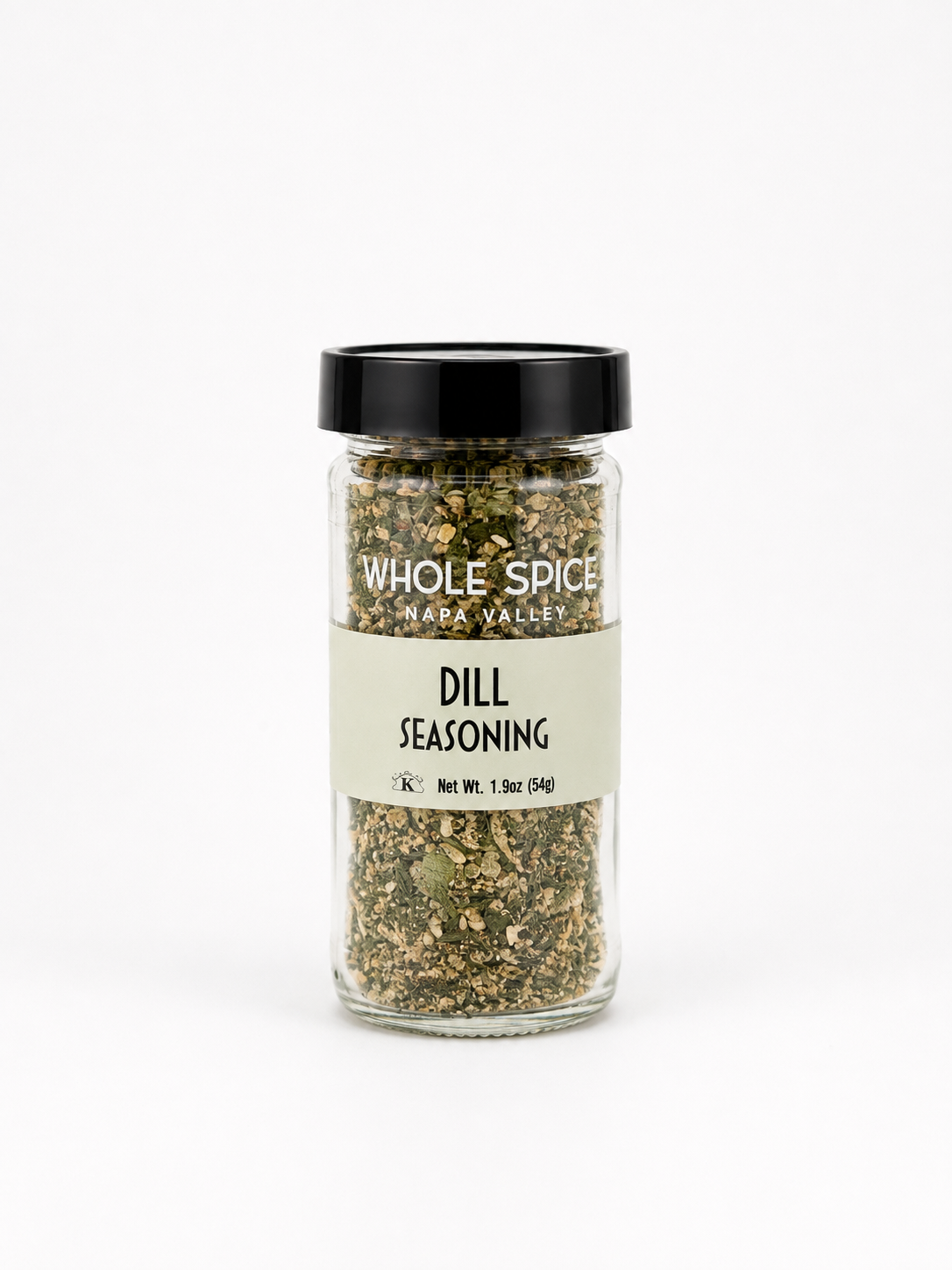 A clear glass jar with a black lid, labeled Whole Spice Inc. Dill Seasoning, contains green and white dried herbs perfect for seasoning chicken or vegetables. The net weight is 1.9 oz (54 g). The jar is centered on a white background.