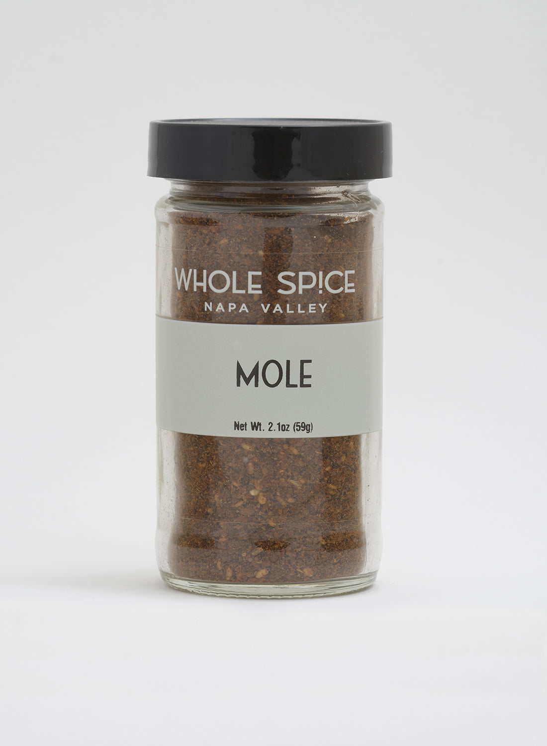 A 2.1 oz (59g) jar of Mole chocolate spice blend by Whole Spice Inc., with a black lid and labeled branding, is shown against a plain white background.