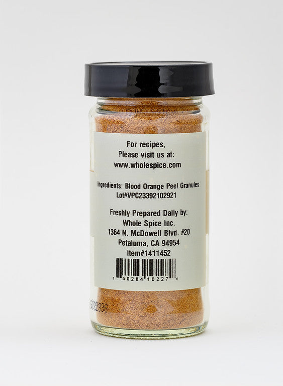 Blood Orange Peel Powder by Whole Spice Inc. comes in a glass jar with a black lid. The white label lists ingredients, origin, and contact info—ideal for baking or adding vibrant zest to your dishes.