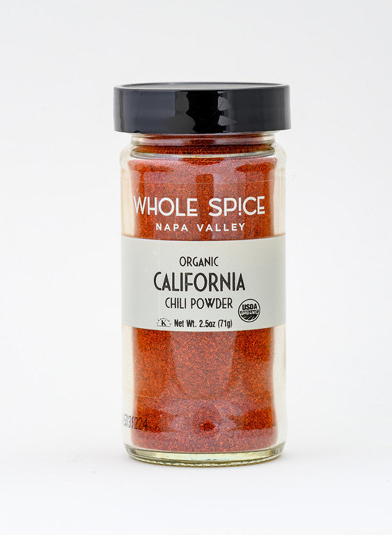 Whole Spice Inc. California Chili Powder Organic comes in a 2.5 oz glass jar with a black lid and white label featuring the USDA organic seal. Made from Anaheim peppers, it’s perfect for adding rich flavor to Mexican dishes.