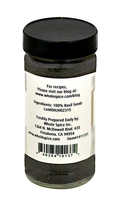 A clear spice jar labeled “Basil Seeds” from Whole Spice Inc. displays ingredients as 100% basil seeds (sabja). The white label includes the Petaluma, CA address and a barcode at the bottom.