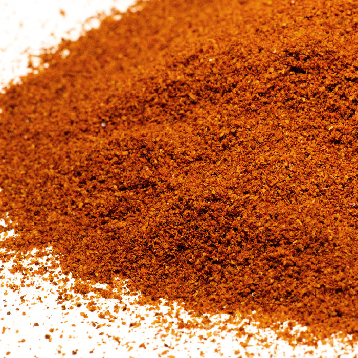 Whole Spice Inc. Chili Seasoning, a vibrant orange powder, is perfect for boosting flavor in chili recipes or adding authentic Mexican spices to your dishes.