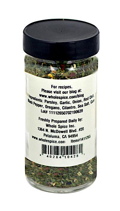 Whole Spice Inc. Chimichurri Seasoning comes in a clear jar with a black lid, featuring a blend of parsley, garlic, onion, red chili, black pepper, oregano, cilantro, and sea salt—ideal for grilled meats or South American sauces.