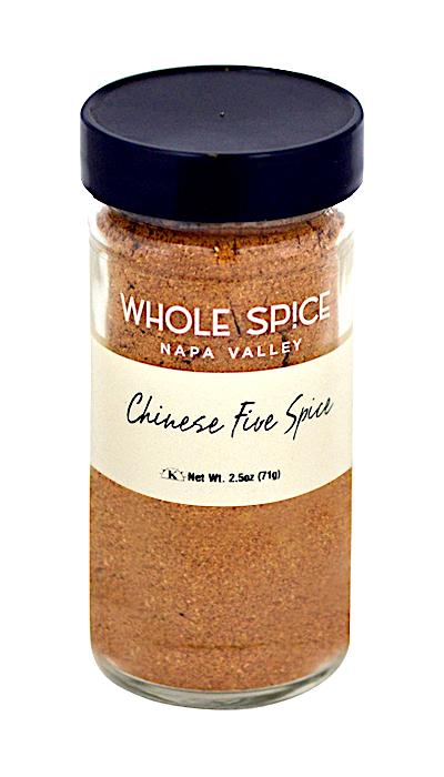 A clear glass jar with a black lid filled with aromatic Chinese Five Spice powder by Whole Spice Inc., net weight 2.5 oz (71g).