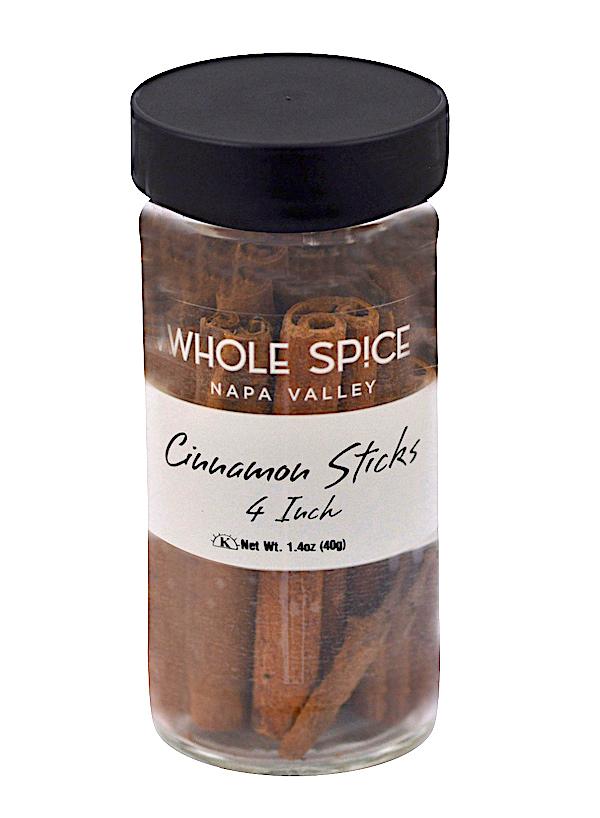 A clear glass jar with a black lid contains Cinnamon Sticks 4 inch by Whole Spice Inc., Net Wt. 1.4oz (40g).