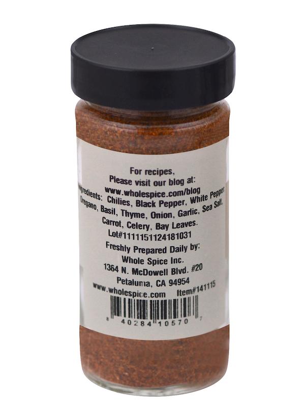 Creole Seasoning by Whole Spice Inc. comes in a clear jar with black lid and label listing ingredients like chilies, pepper, and basil. This versatile blend is ideal for seasoning, with company info and website on the label.