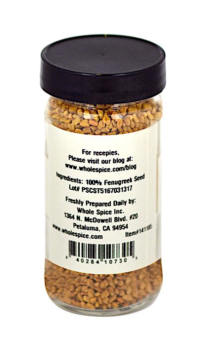 Whole Spice Inc. Fenugreek Seeds come in a clear glass jar with a black lid. The label lists 100% fenugreek seed, company info, preparation location, and website; seeds are often used in Indian curries and Yemeni Hulba.