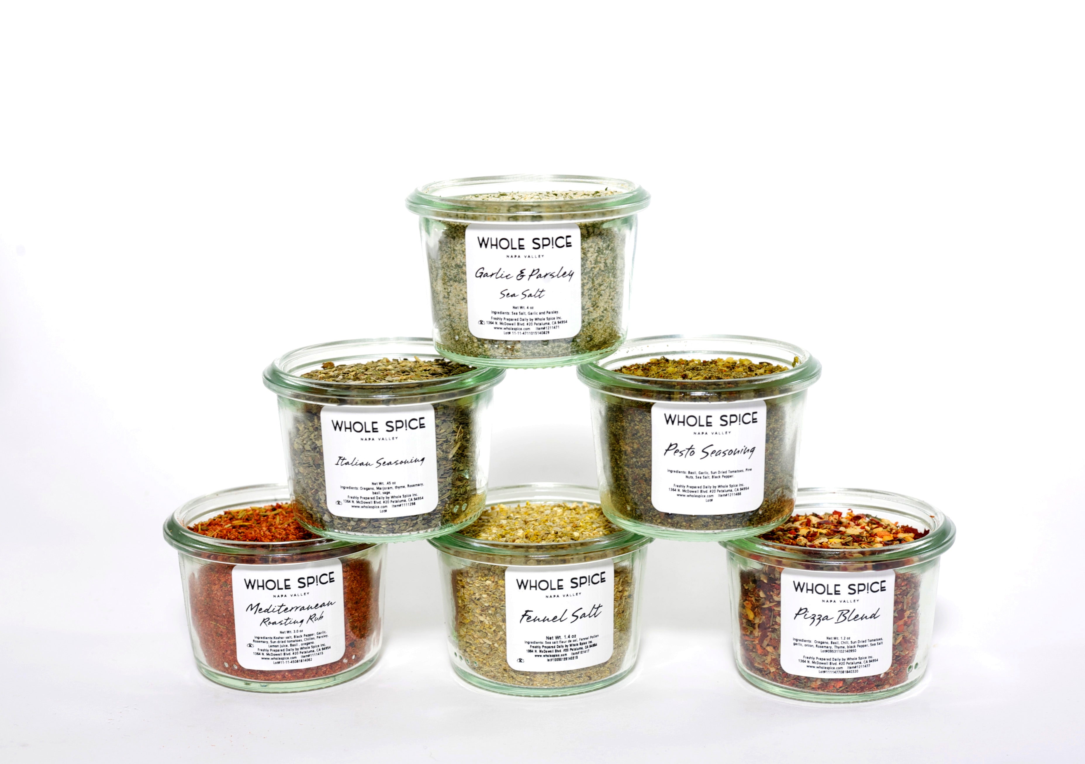 The Whole Spice Inc. Weck Jar Small Mediterranean Gift Set features six gourmet seasonings in a pyramid: Garlic & Parsley Sea Salt, Italian Seasoning, Pork Seasoning, Watermelon Medley, Fennel Salt, and Pepper Blend—an ideal gift.