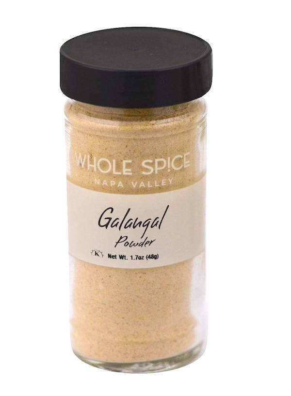 Whole Spice Inc. Galangal Powder with a black lid, ideal for bringing authentic flavor to Thai Coconut Soup.