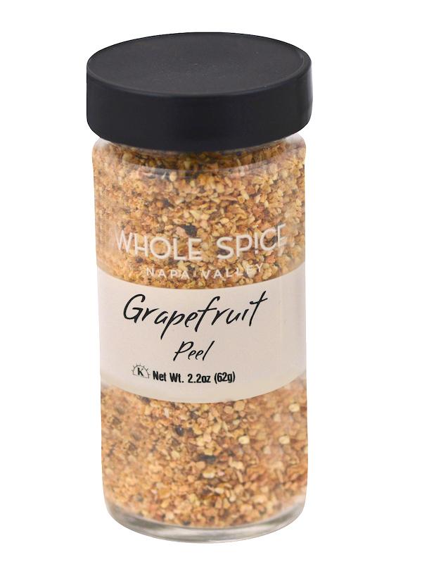 A clear glass jar from Whole Spice Inc. labeled Grapefruit Peel holds dried grapefruit peel pieces, great for marmalades. The jar has a black lid and a net weight of 2.2 oz (62g).