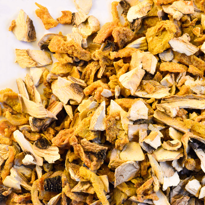 A close-up of Whole Spice Inc. Mushroom Israeli Couscous Seasoning shows a pile of dried, chopped mushrooms in various brown, beige, and cream shades—perfect for adding rich texture and flavor to your couscous.