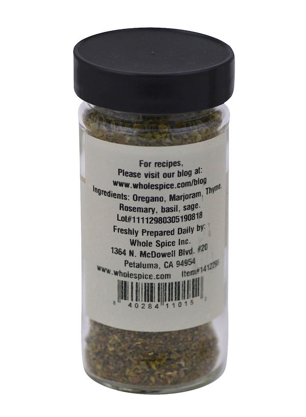 A clear spice jar with a black lid featuring Whole Spice Inc.’s Italian Seasoning Large Cut; the back label lists herbs like oregano, marjoram, thyme, rosemary, basil, and sage plus contact info for Whole Spice in Petaluma, CA.