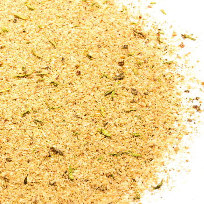 Whole Spice Inc.'s Jerk Seasoning is an aromatic blend of yellow and green spices, offering vibrant flavors for an authentic kick.