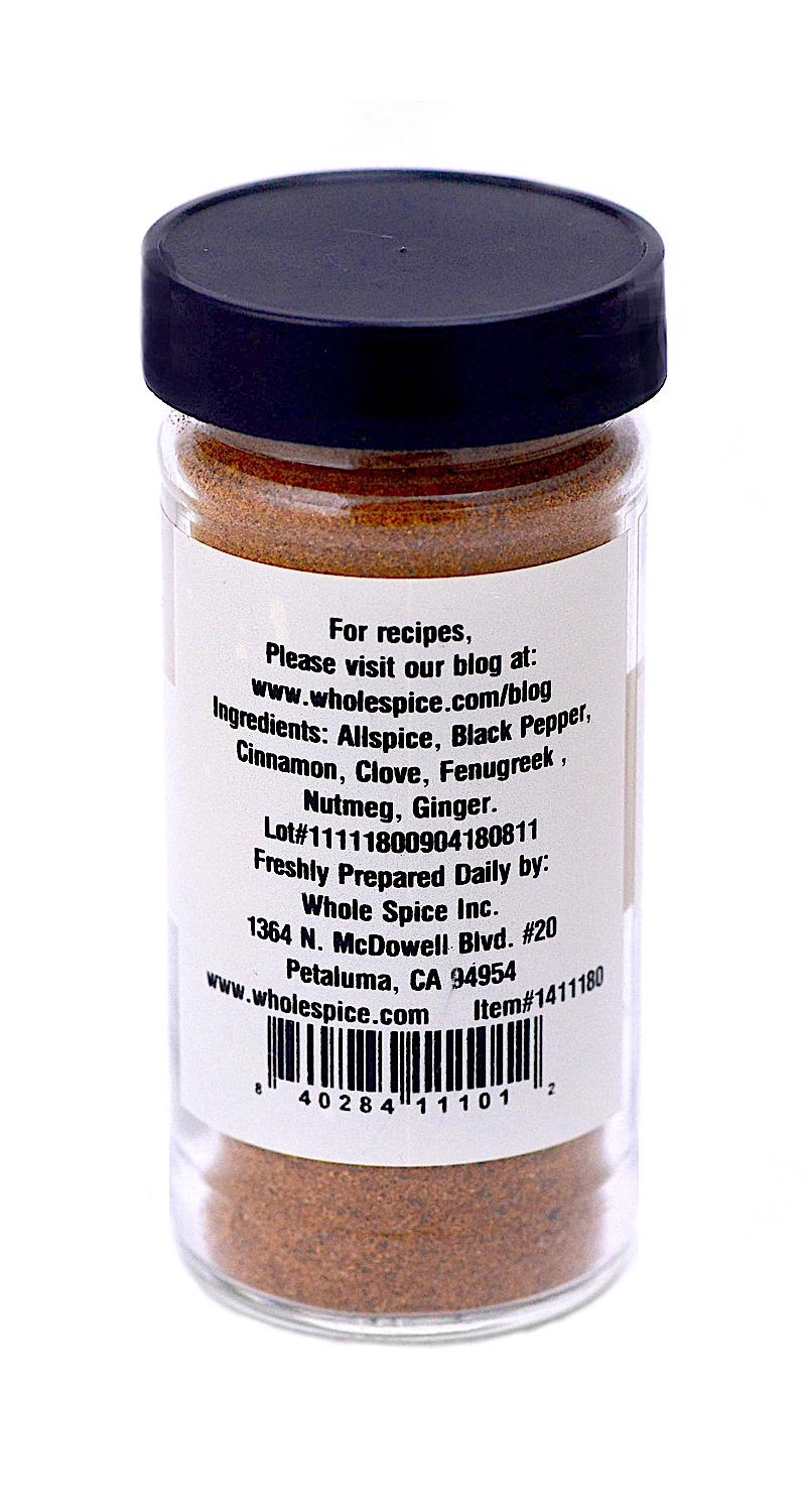 Lebanese Seven Spice by Whole Spice Inc. comes in a clear jar with black lid, featuring a white label listing aromatic spices: allspice, black pepper, cinnamon, clove, fenugreek, nutmeg, and ginger—ideal for blends or meat rubs. Preparation and contact info included.