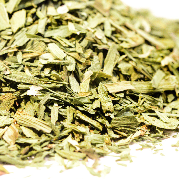 Whole Spice Inc. Leek Flakes offer mild onion flavor, ideal for soups, with a vibrant green leaf appearance.