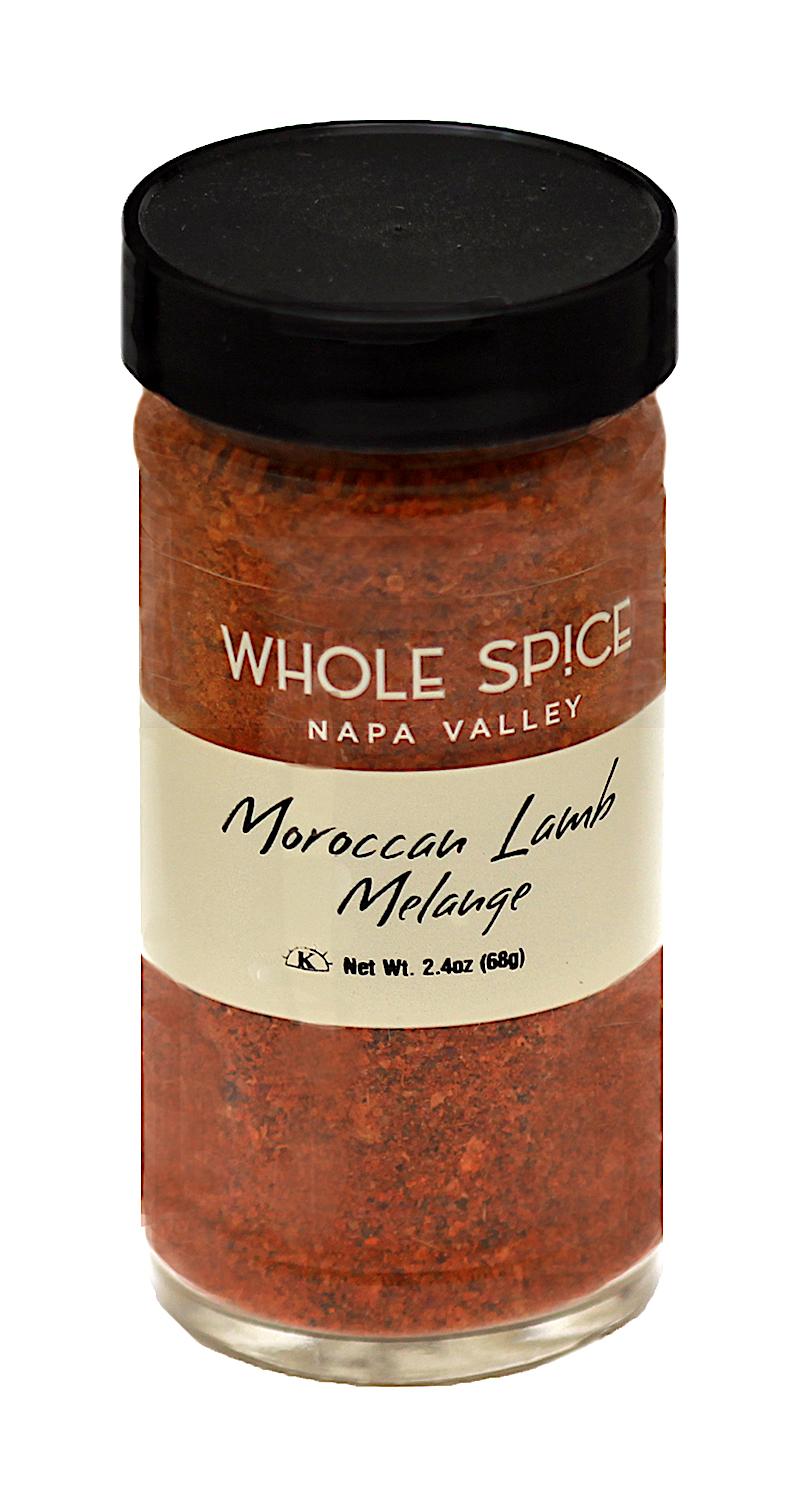 A glass jar of Whole Spice Inc. Moroccan Lamb Melange spice blend with a black lid and beige label displaying the product name and net weight of 2.4 oz (68g).