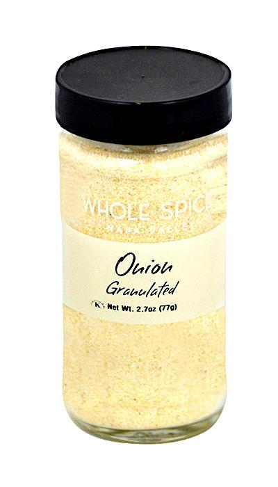 A bottle of Whole Spice Inc. Onion Granulated with a black lid, perfect as a versatile culinary ingredient.