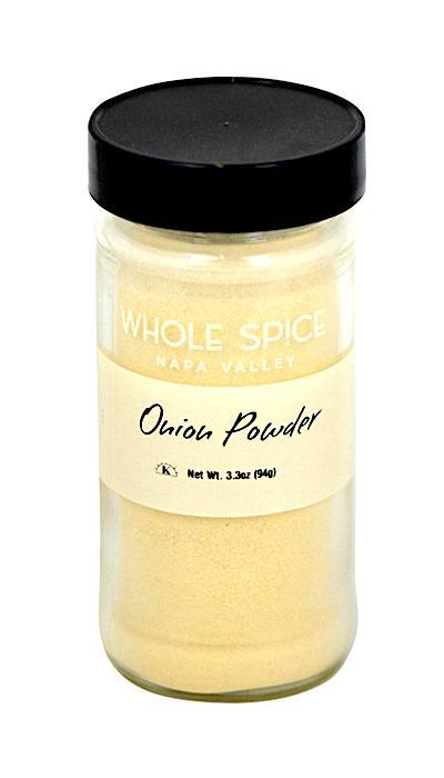 A 3.3 oz clear glass jar with a black lid labeled “Whole Spice Inc. Onion Powder,” filled with light beige onion spice, perfect as a versatile ingredient for cooking.