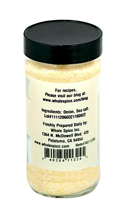 Whole Spice Inc. Onion Salt comes in a clear jar with a black lid, featuring onion and sea salt on the label, plus the manufacturer's contact info—ideal for adding gourmet flavor to your meals.