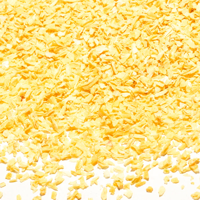 Whole Spice Inc. Onion Minced offers yellow dehydrated onion chips, perfect as a distinct and flavorful ingredient for your recipes.