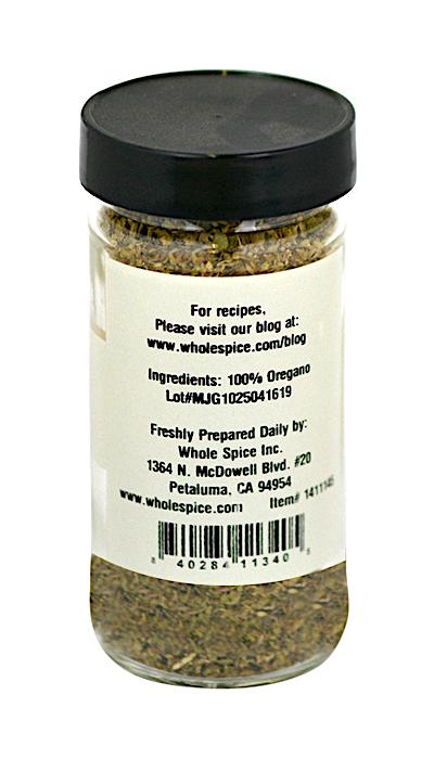 Whole Spice Inc. Oregano (Greek) comes in a clear glass jar with a black lid, containing 100% oregano. The label includes the website, lot number, and Whole Spice Inc.’s address in Petaluma, California.
