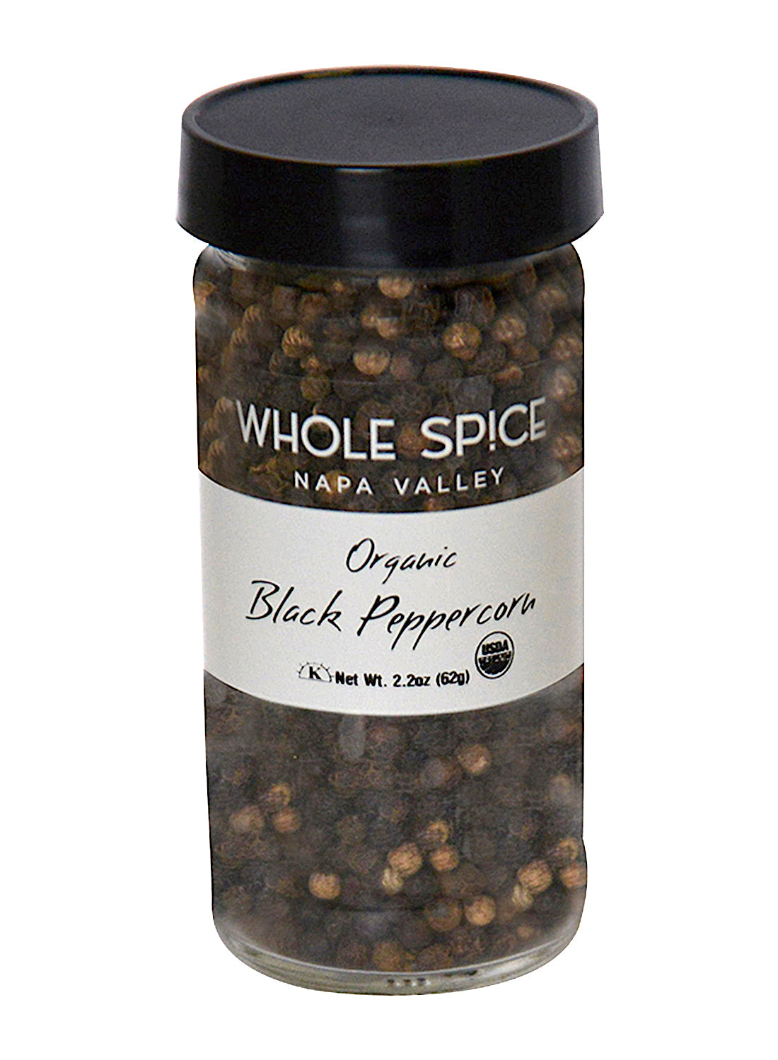A glass jar of Whole Spice Inc. Peppercorns Black 100% Organic, known as the King of Spices, contains whole black pepper with a black plastic lid. Net weight: 2.2 oz (62g).