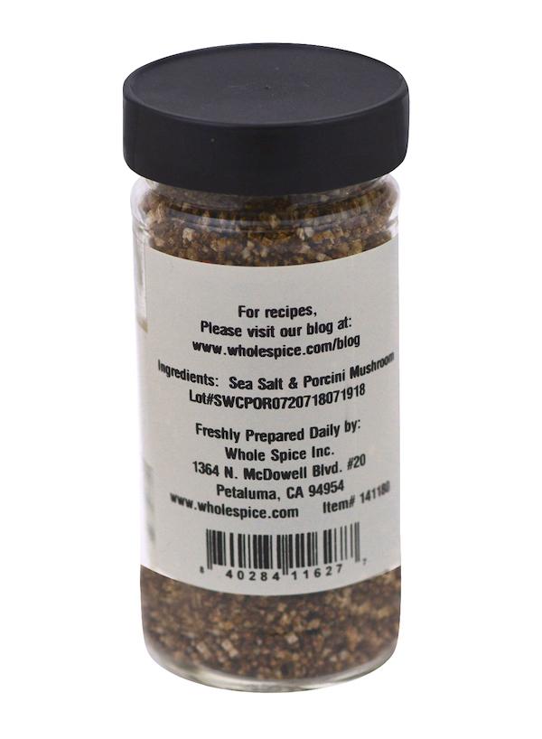 Whole Spice Inc.’s Porcini Mushroom Sea Salt comes in a spice jar with a black lid, lists sea salt and porcini mushroom as ingredients, and offers preparation tips plus company info. Ideal as a finishing salt to boost mushroom flavor.