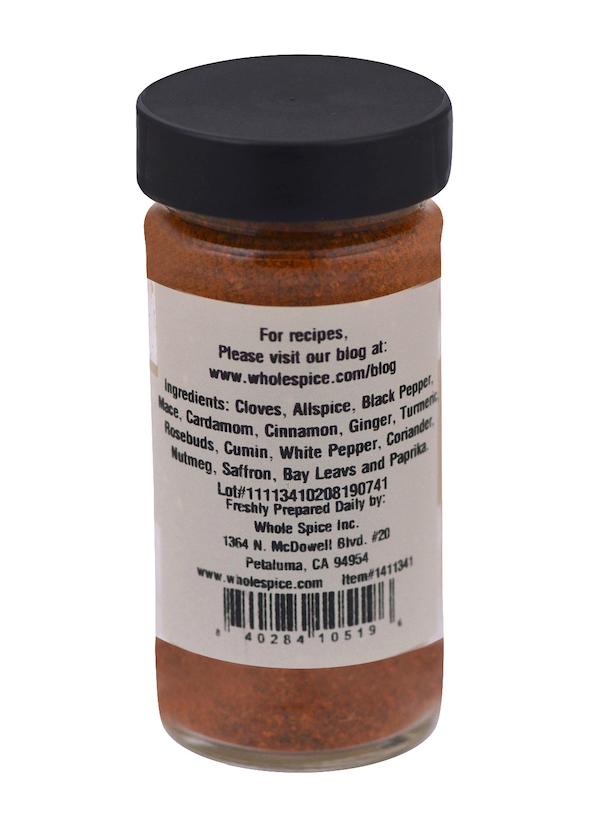 Whole Spice Inc.’s Ras el Hanout Coarse Ground features a white label listing spices like cloves, allspice, black pepper, cardamom, cinnamon, and more—plus the company website, address, and barcode—ideal for making Moroccan blends.