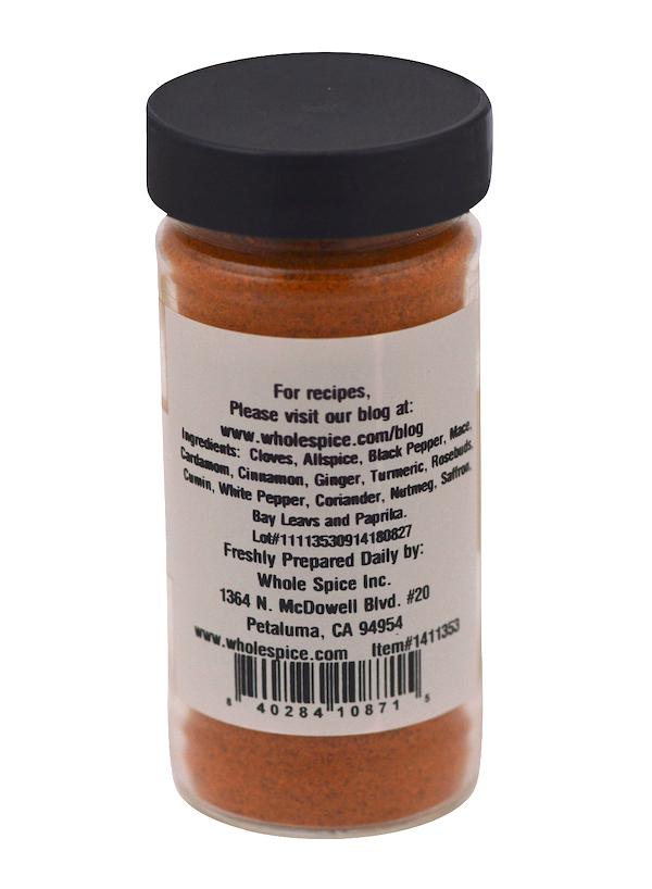 A jar of Ras el Hanout Ground by Whole Spice Inc., featuring a labeled container filled with aromatic spices from an authentic Moroccan blend.