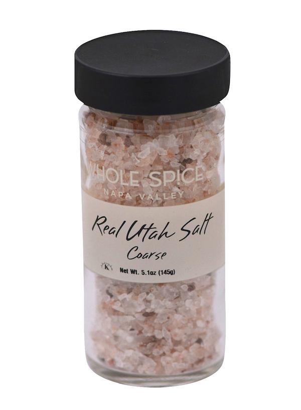 A jar of Whole Spice Inc.'s Real Utah Salt Coarse, with a black lid and coarse salt rich in trace minerals.