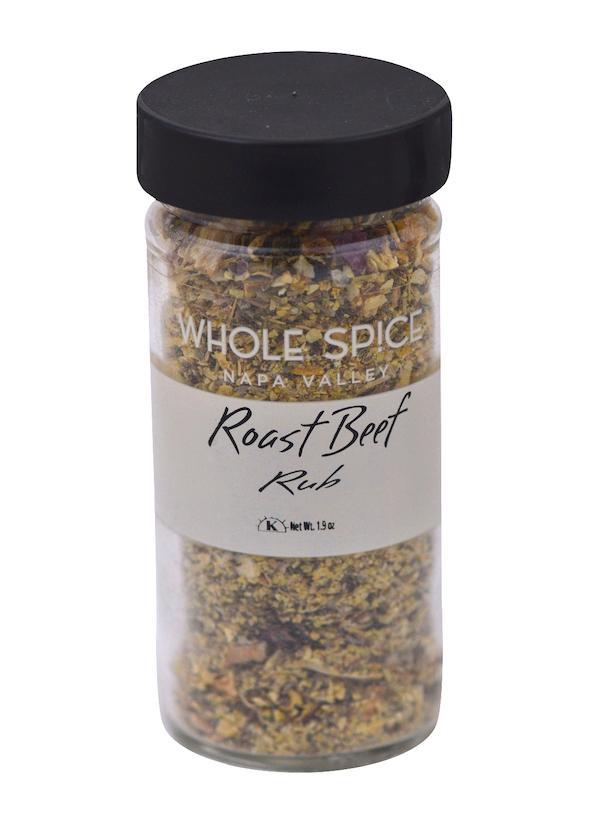 A clear spice jar labeled Roast Beef Rub by Whole Spice Inc. with a black lid, filled with a coarse blend of herbs and beef seasoning for an aromatic crust. Net weight: 1.9 oz.