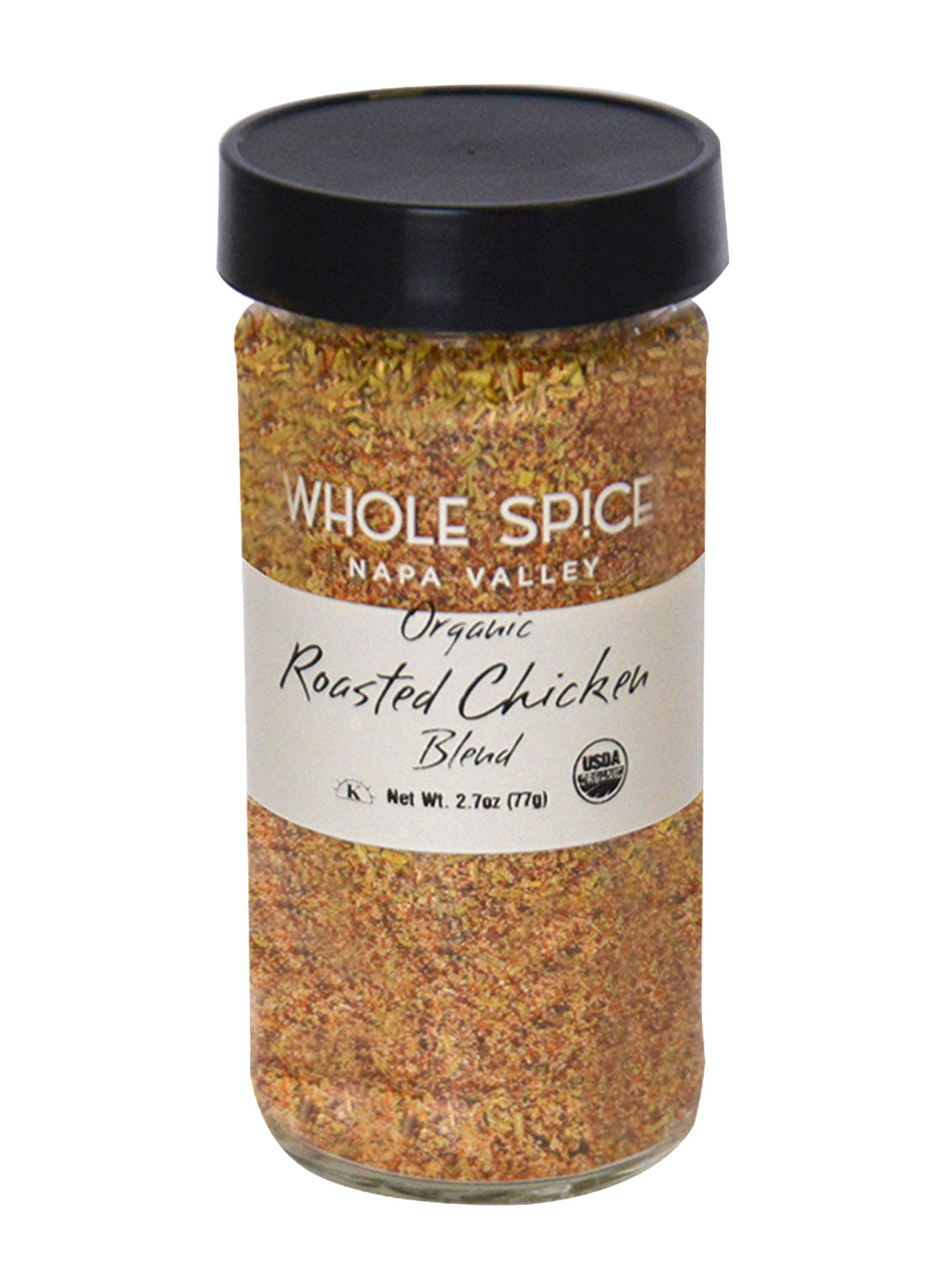 A glass jar labeled Whole Spice Inc. Roasted Chicken Blend Organic, containing a coarse mix of organic spices and French gray salt, with a black lid and a white label featuring black and gold text.
