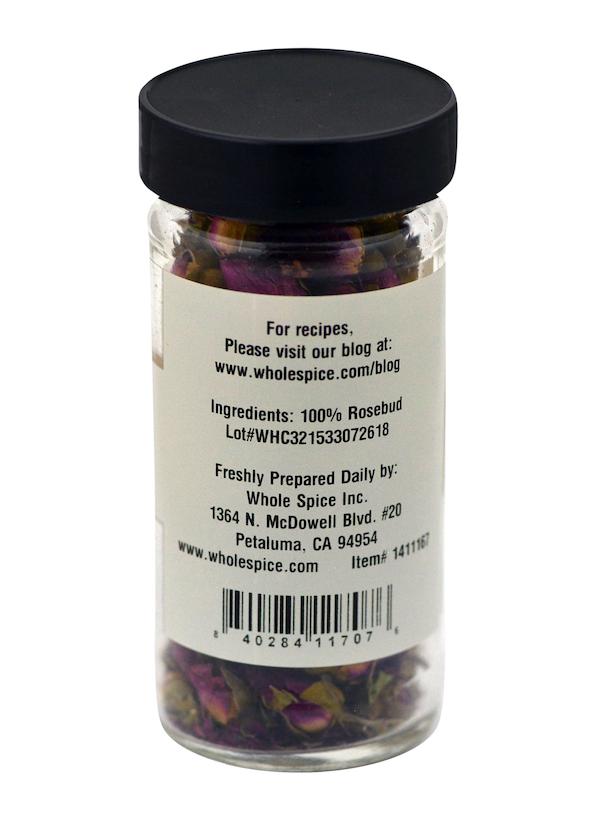 Whole Spice Inc. Rosebuds come in a clear jar with a black lid, filled with 100% rosebud—ideal for baking or fragrance. The label shows ingredients, barcode, prep instructions, and Whole Spice Inc.’s contact info.