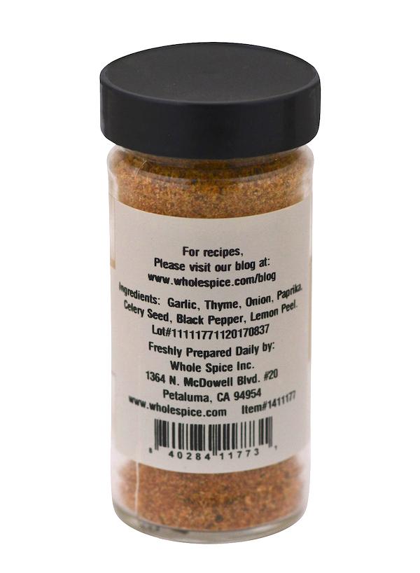 The clear Salt-Free Seasoning jar from Whole Spice Inc. has a black lid and a label listing garlic, thyme, onion, paprika, celery seed, black pepper, and lemon peel. Label includes recipe ideas and company info.