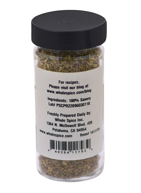 A clear spice jar with a black lid labeled “Savory Leaves”—100% savory leaves, an annual herb known for its peppery flavor. The label lists ingredient, lot number, preparation info, and Whole Spice Inc. (Petaluma, CA) as the brand.