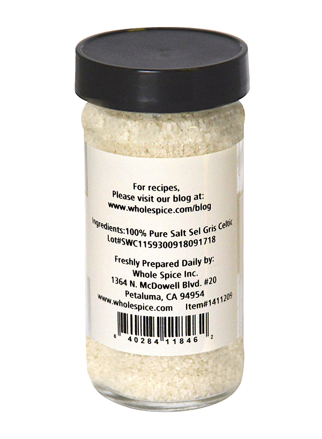 A clear spice jar with a black lid, filled with Sel Gris Salt by Whole Spice Inc. The label lists ingredients, company info, website, and barcode. This 100% pure French Gray Salt is ideal as a premium cooking salt for your kitchen.