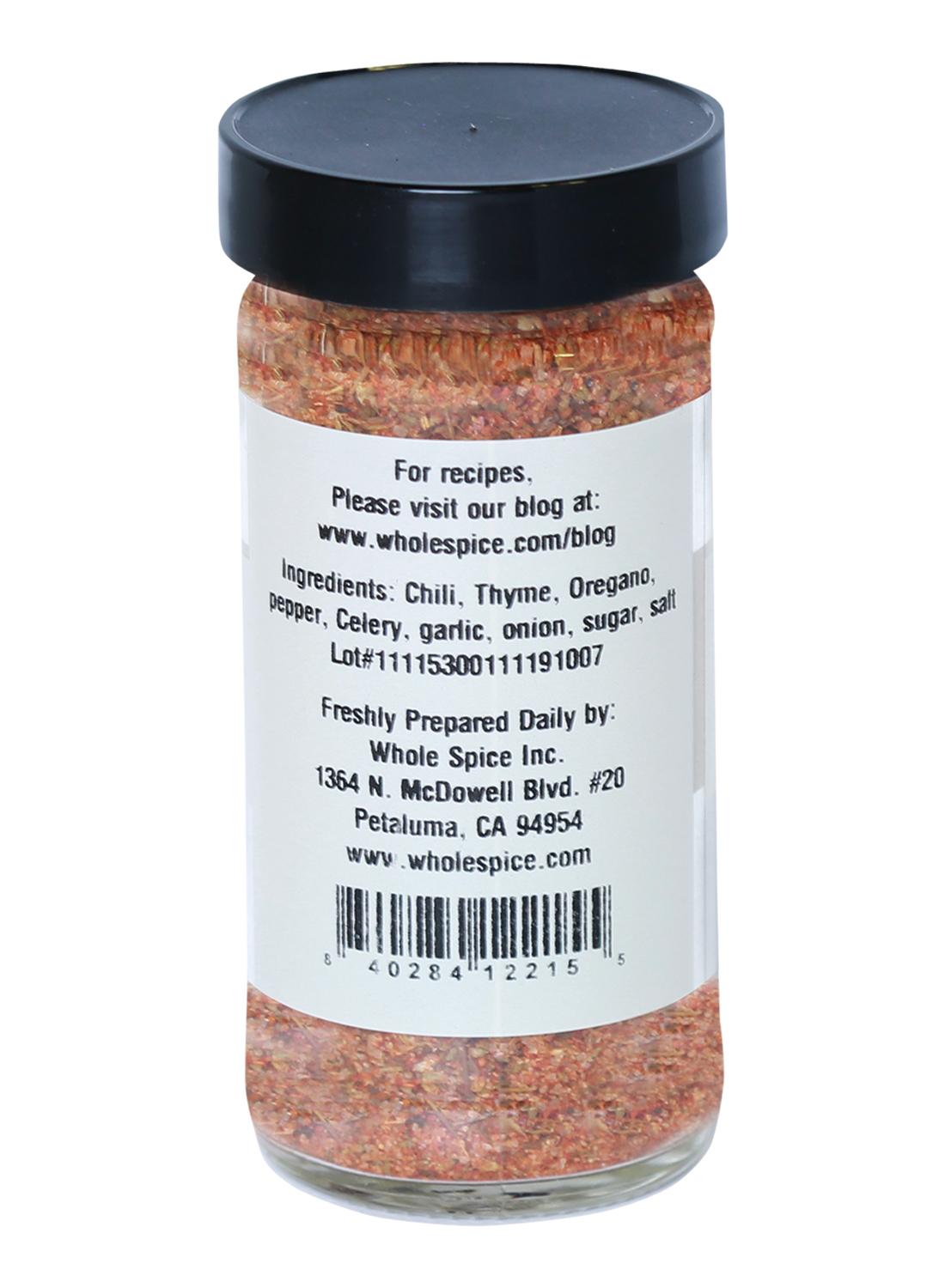 A clear jar with a black lid shows the Steak House Rub label by Whole Spice Inc., listing chili, thyme, oregano, pepper, celery, garlic, onion, sugar & salt—great for beef. Contact info and barcode are also visible.