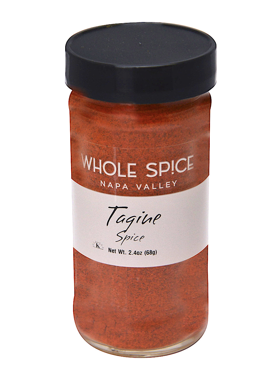 A 2.4 oz (68g) glass jar of Whole Spice Inc. Tagine Spice features a black lid and contains a reddish-orange Moroccan seasoning blend inspired by North African spices.