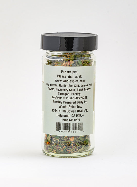 Whole Spice Inc.'s Rotisserie Chicken Rub comes in a glass jar with a black lid and contains a dried herb and spice blend, including garlic, sea salt, and lemon peel. The label lists ingredients, website, and company info from Petaluma, CA.