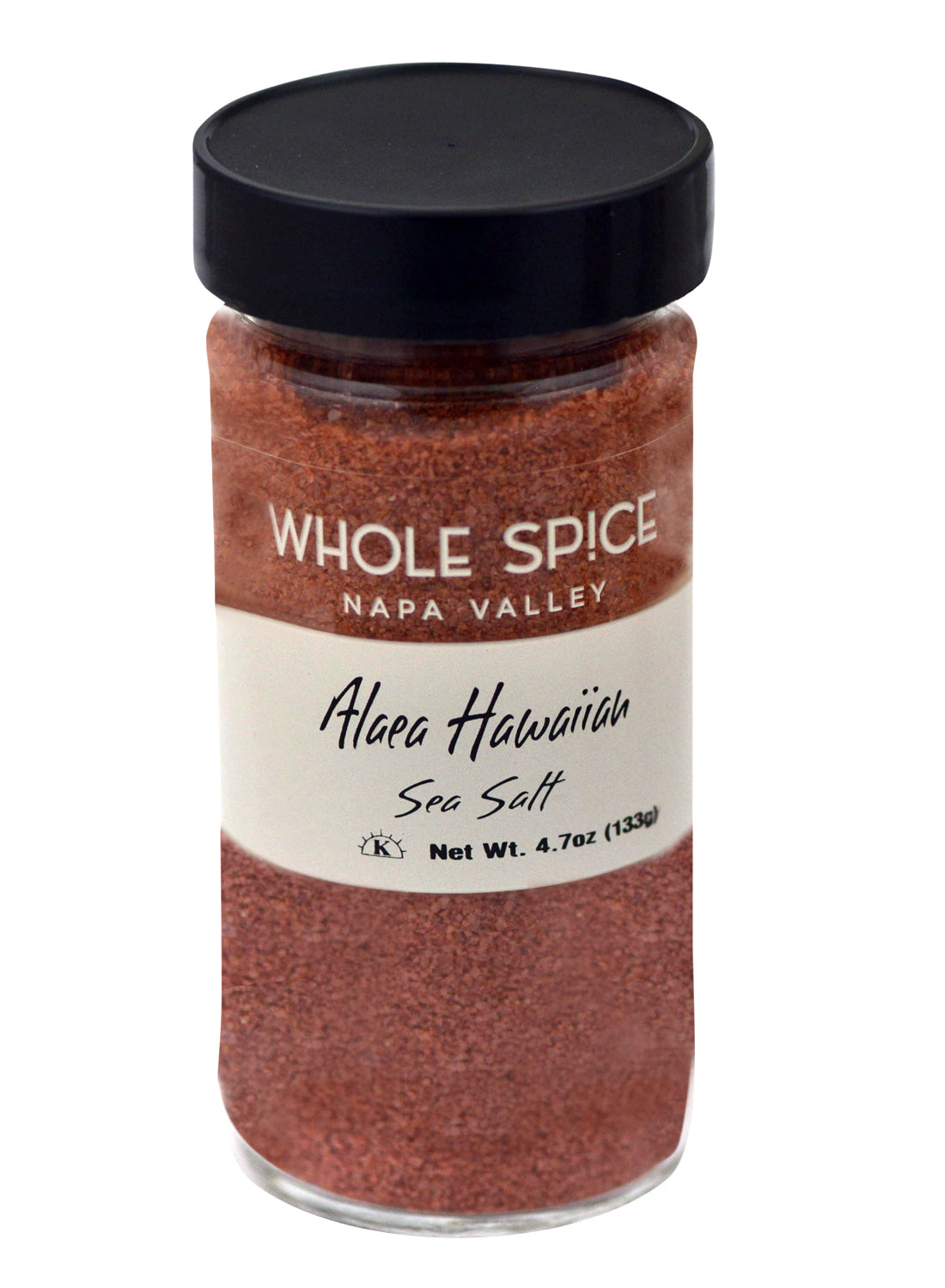 A clear glass jar with a black lid labeled Whole Spice Inc. Alaea Hawaiian Sea Salt contains reddish-brown salt infused with Red Alaea Clay. Net weight: 4.7 oz (133g).
