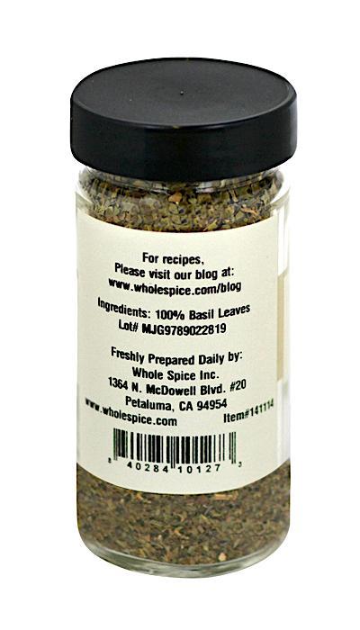 Whole Spice Inc. Basil Leaves come in a clear glass jar with a black lid. The label lists 100% basil leaves as the ingredient and includes company info with an address in Petaluma, CA—ideal for your favorite recipes.