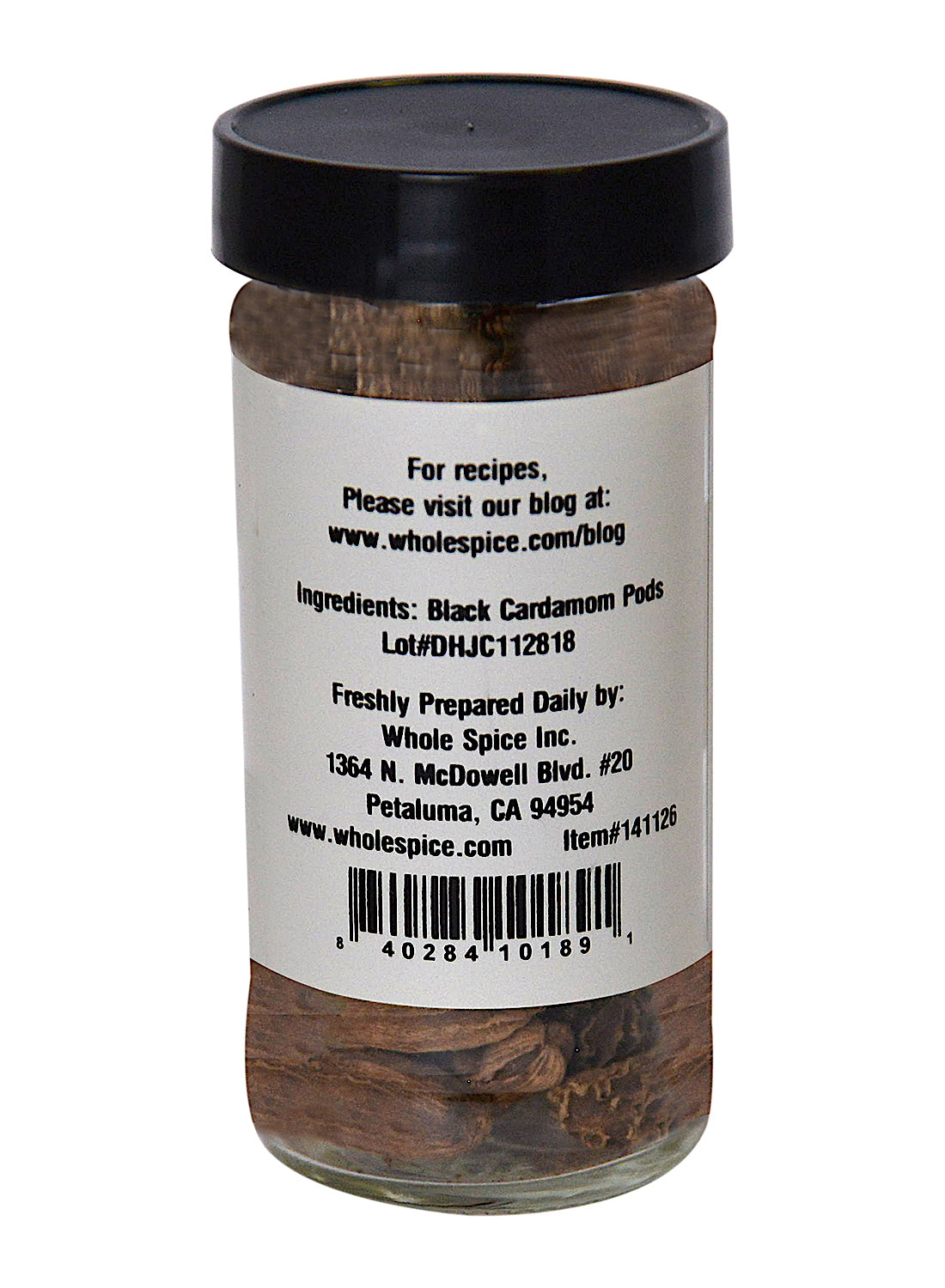 A glass jar of Whole Spice Inc. Black Cardamom Pods, a garam masala essential. The label features black cardamom pods, company info, a recipe blog link, and a barcode.