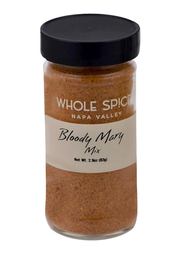A glass jar labeled Whole Spice Inc. Bloody Mary Mix, containing a reddish-brown cocktail seasoning blend with a black lid and net weight of 2.9 oz (82g).