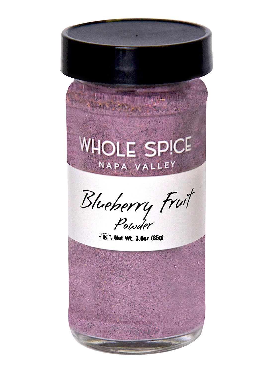 A clear glass jar with a black lid contains Whole Spice Inc. Blueberry Fruit Powder, Net Wt. 3.0oz (85g)—ideal for topping desserts or boosting smoothies.