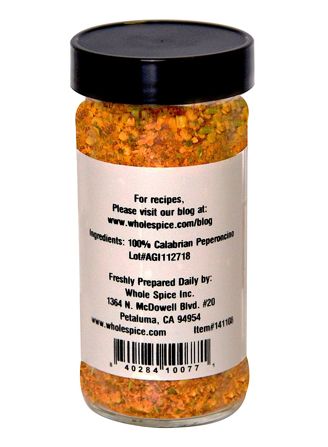 A jar of Whole Spice Inc. Calabrian Peperoncino Chili Flakes features Calabrian chili on the label, plus ingredients, recipe website, and Petaluma, CA contact info. The barcode is displayed at the bottom.