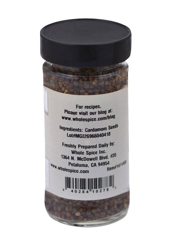 Whole Spice Inc. Cardamom Seeds come in a clear glass jar with a black lid; the label lists cardamom seeds as the only ingredient, company info, and a barcode at the bottom—perfect for Indian recipes.