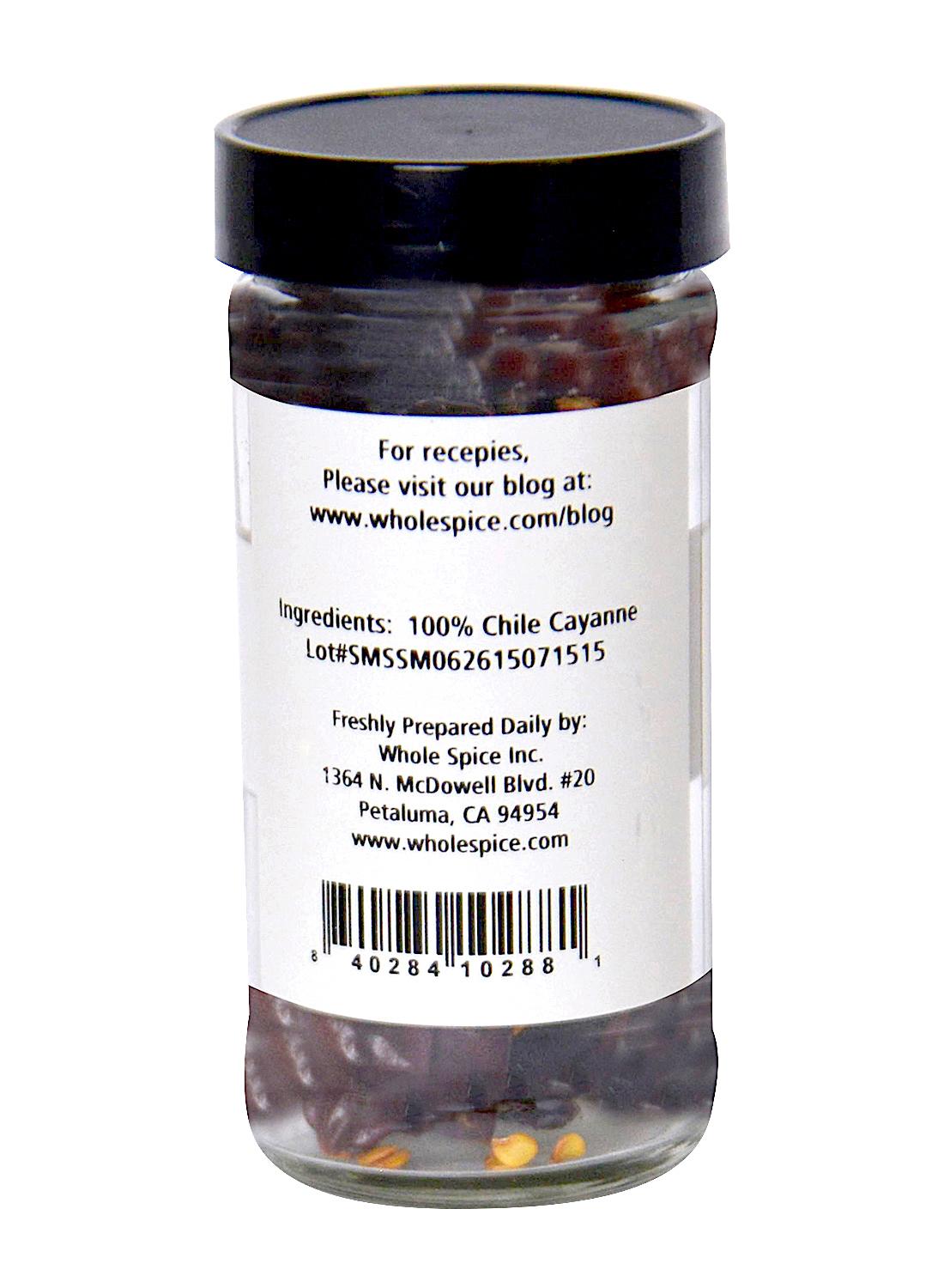 A jar of Cayenne Chili Whole from Whole Spice Inc. with a label highlighting its spicy kick.