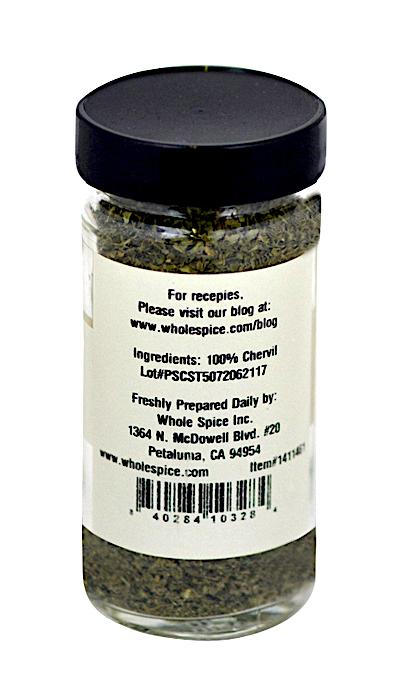 A clear spice jar with a black lid holds Whole Spice Inc.'s Chervil, prized for its delicate, herbal-anise flavor. The white label features ingredients, preparation tips, a website, barcode, and Whole Spice Inc.’s Petaluma address.