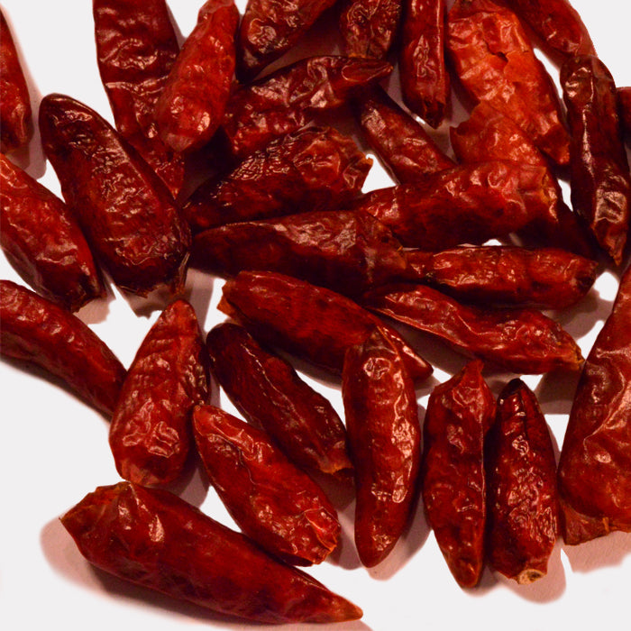 Whole Spice Inc. Bird's Eye Chili Whole features vibrant red chilies, perfect for adding fiery heat to your favorite dishes.