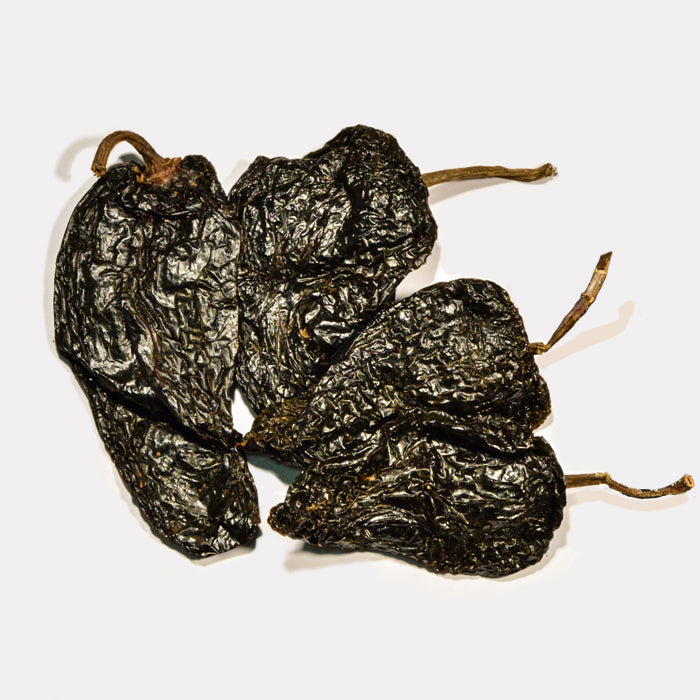 Mulato Chili Whole by Whole Spice Inc. is a dried pepper commonly used in Mexican cuisine and traditional dishes like mole poblano.